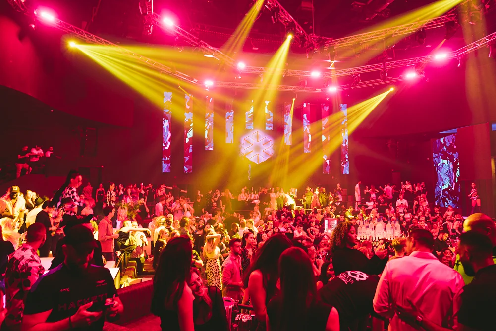 WHITE Abu Dhabi dance floor under red and gold stage lighting