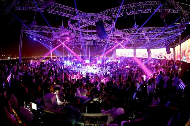 Archive photo of WHITE Dubai's rooftop crowd beneath purple lighting